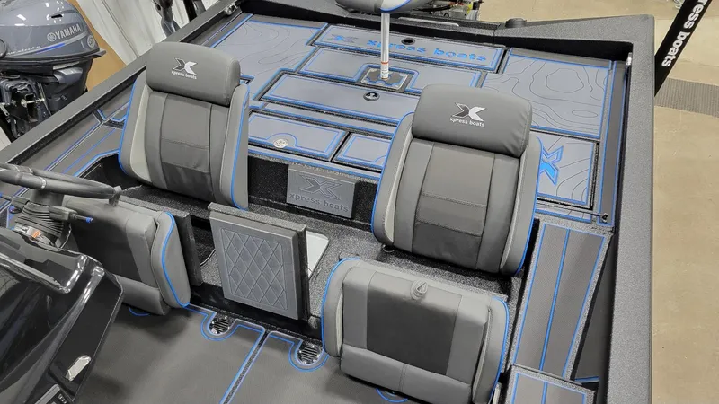 Slide: The Image of 2025 Xpress X21 Pro Bass boat interior with Yamaha Vmax 250 engine, featuring sleek seating. - 8
