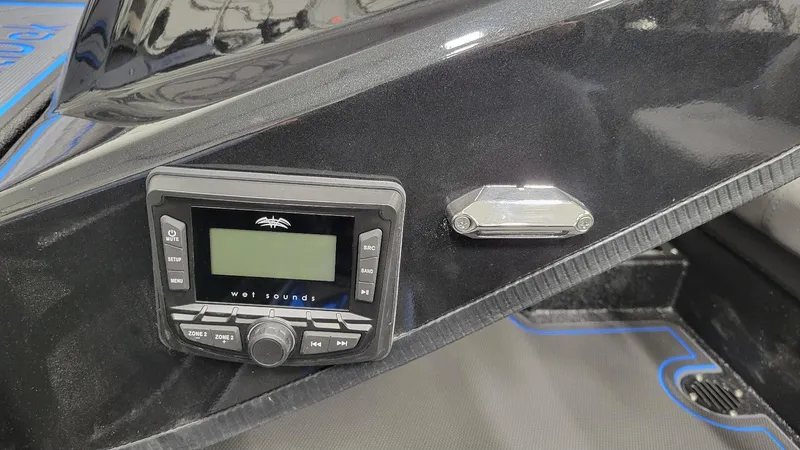 Slide: The Image of Control panel of 2025 Xpress X21 Pro Bass boat with audio system. - 9