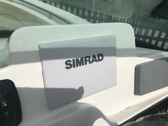 Slide: The Image of Simrad navigation system on 2019 NauticStar 2302 LDC boat dashboard. - 16