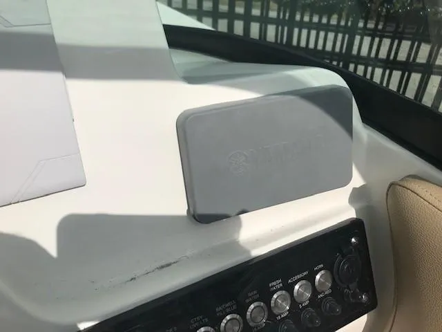 Slide: The Image of Control panel of 2019 NauticStar 2302 LDC boat with Yamaha cover. - 17