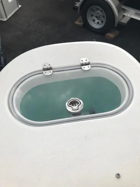 Slide: The Image of Livewell on 2019 NauticStar 2302 LDC boat, filled with water. - 27