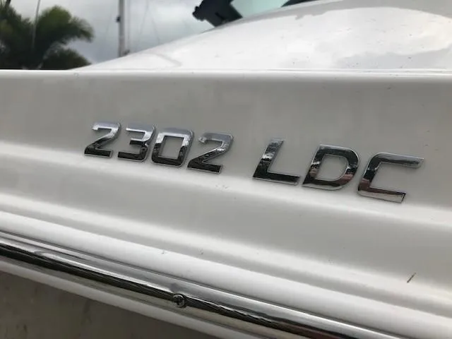 Slide: The Image of Close-up of 2019 NauticStar 2302 LDC boat model emblem. - 44