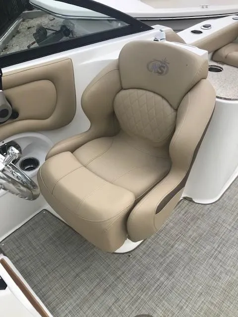 Slide: The Image of 2019 NauticStar 2302 LDC boat seat, beige leather, luxurious design. - 6
