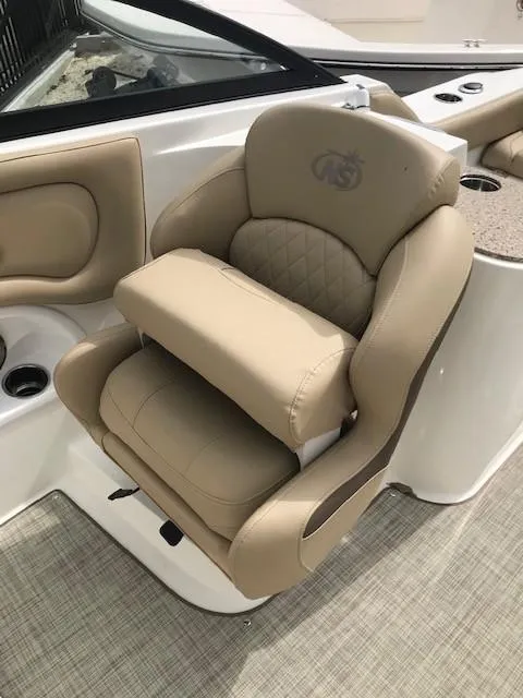 Slide: The Image of 2019 NauticStar 2302 LDC boat seat, beige leather, luxurious design. - 7