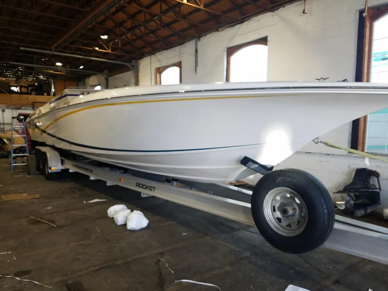 The Image of 2008 Fountain 42 Executioner boat on trailer inside a warehouse. - 1