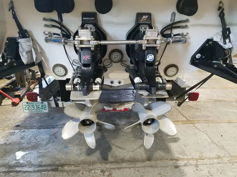 Slide: The Image of 2008 Fountain 42 Executioner boat with dual Mercury XR outboard engines in a garage setting. - 10