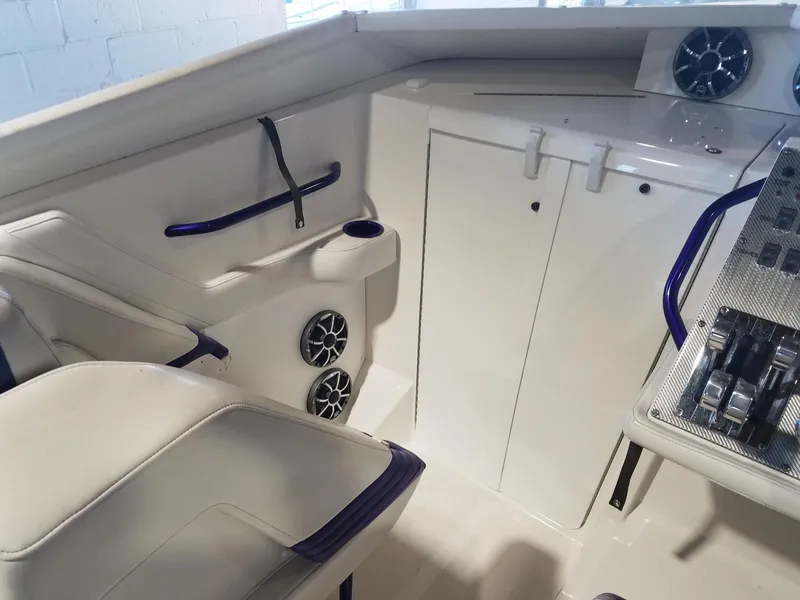 Slide: The Image of Interior of 2008 Fountain 42 Executioner boat with seating and control panel. - 13