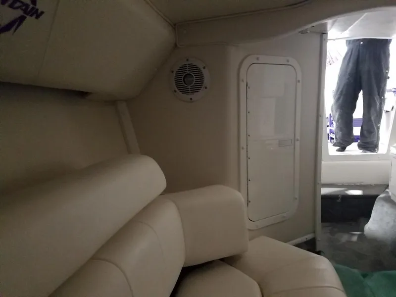 Slide: The Image of Interior of 2008 Fountain 42 Executioner boat with beige seating and speaker. - 15