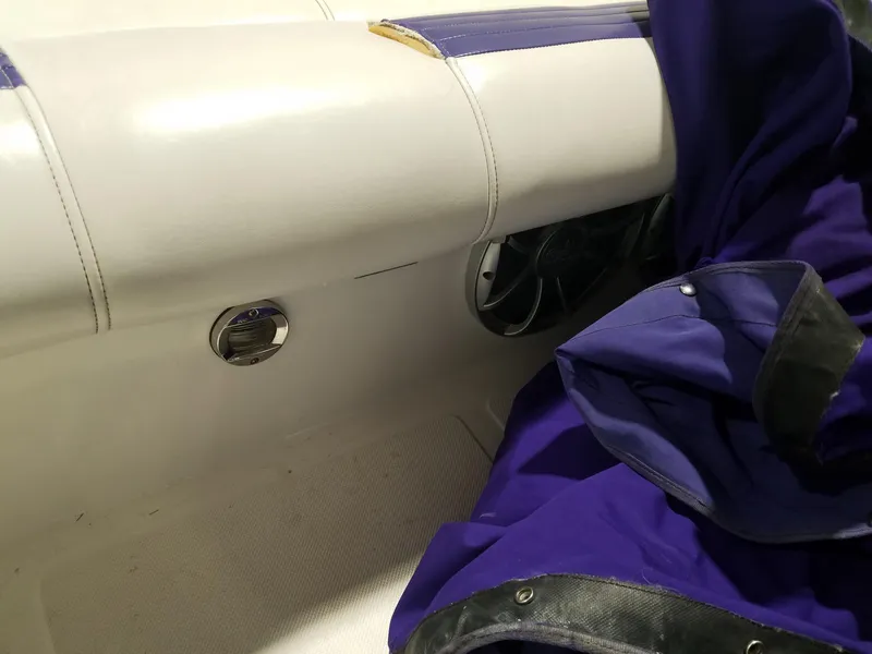 Slide: The Image of 2008 Fountain 42 Executioner interior with white seating and purple cover. - 16