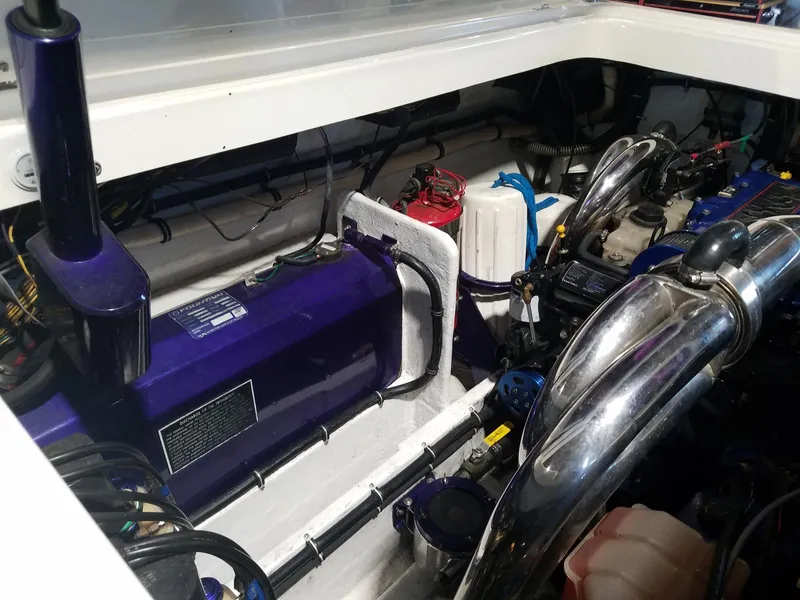 Slide: The Image of Engine compartment of a 2008 Fountain 42 Executioner boat, showcasing mechanical components. - 17