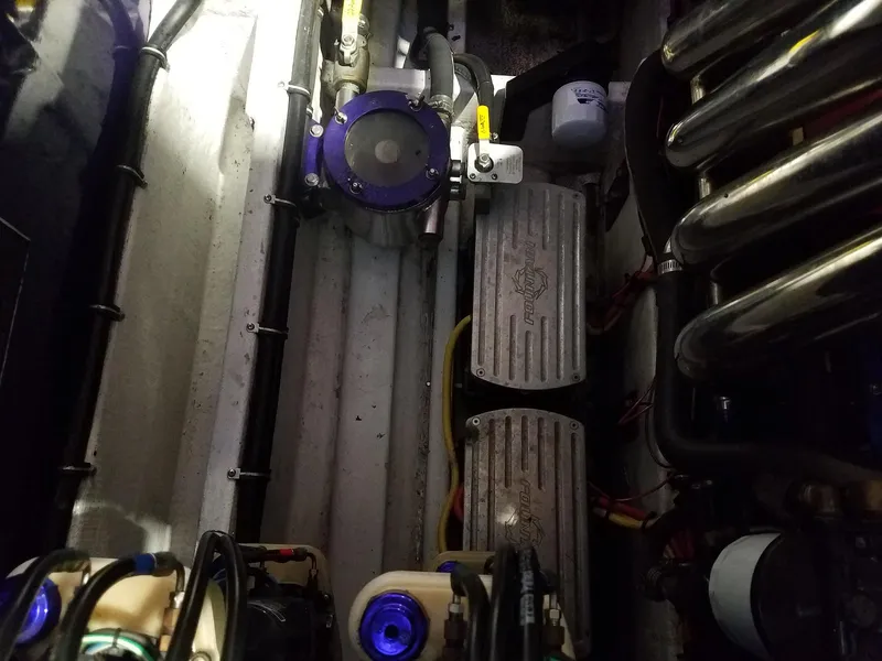 Slide: The Image of Engine compartment of a 2008 Fountain 42 Executioner boat, showcasing mechanical components. - 18
