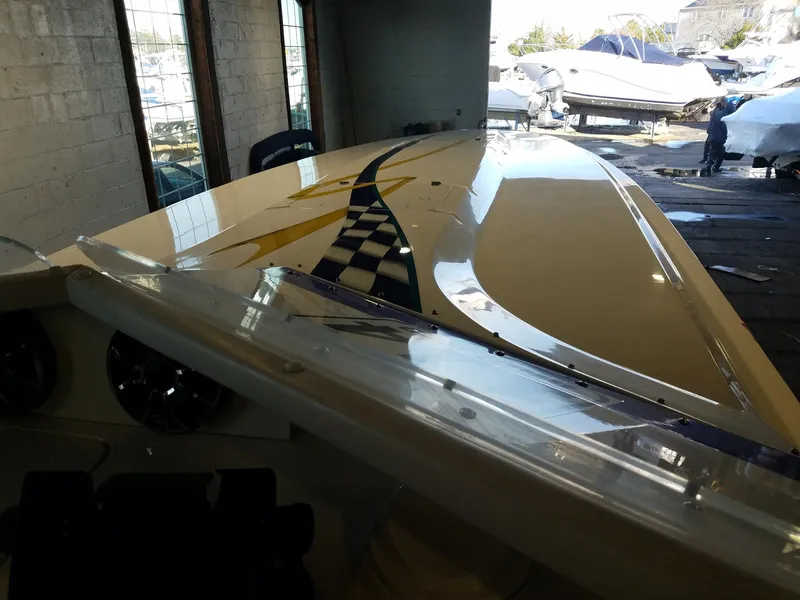 Slide: The Image of 2008 Fountain 42 Executioner boat with sleek design in a storage facility. - 22