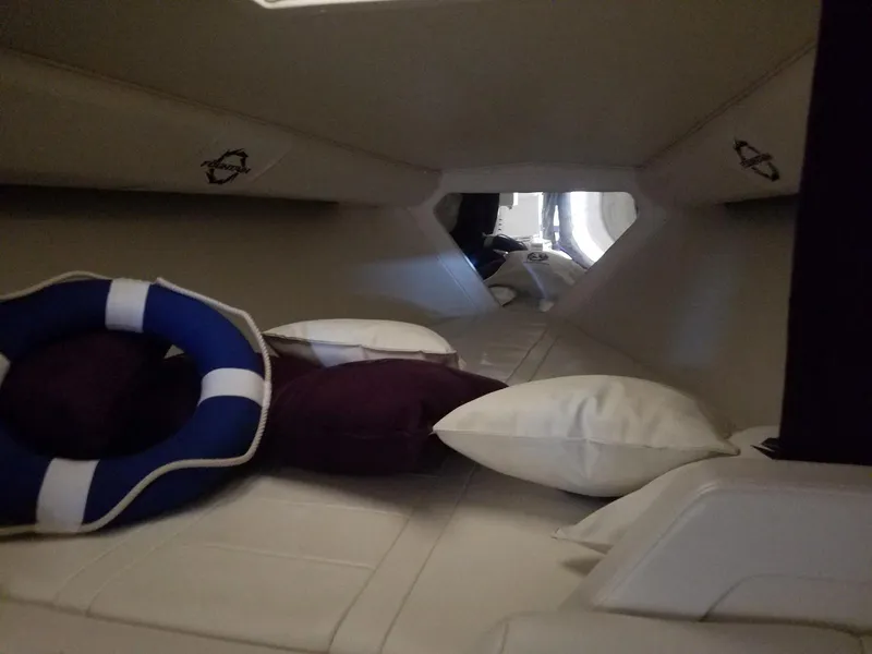 Slide: The Image of Interior cabin of 2008 Fountain 42 Executioner boat with cushions and life preserver. - 23