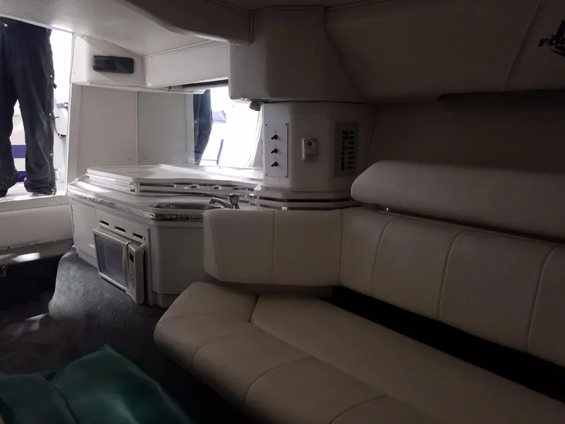 Slide: The Image of Interior of 2008 Fountain 42 Executioner boat with seating and kitchenette area. - 28