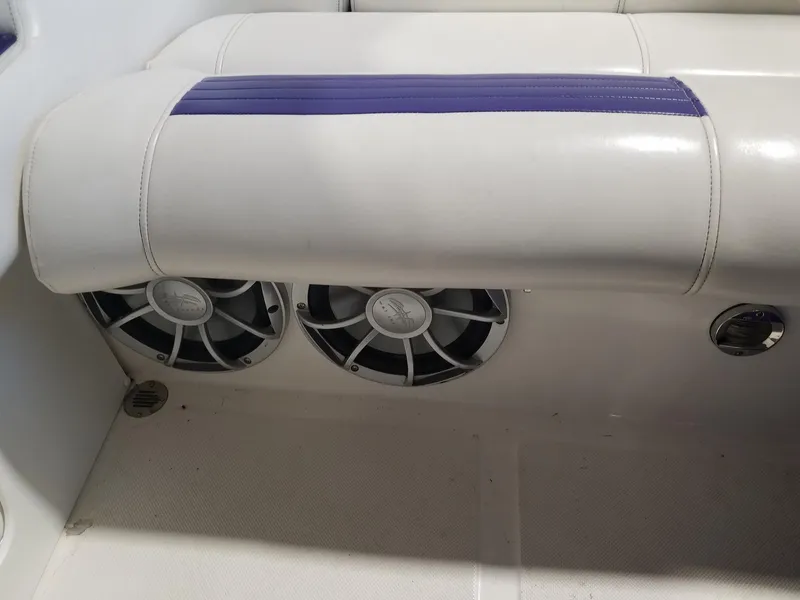 Slide: The Image of 2008 Fountain 42 Executioner boat interior with speakers and white seating. - 29