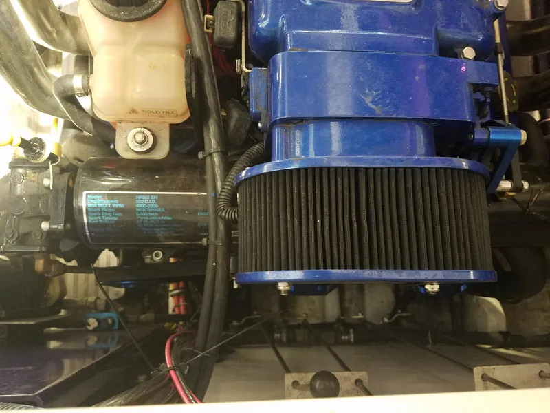 Slide: The Image of Engine components of a 2008 Fountain 42 Executioner boat, featuring a blue air filter. - 30