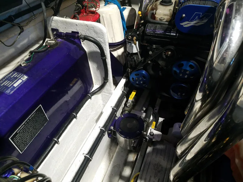 Slide: The Image of Engine compartment of a 2008 Fountain 42 Executioner boat, showcasing mechanical components. - 32