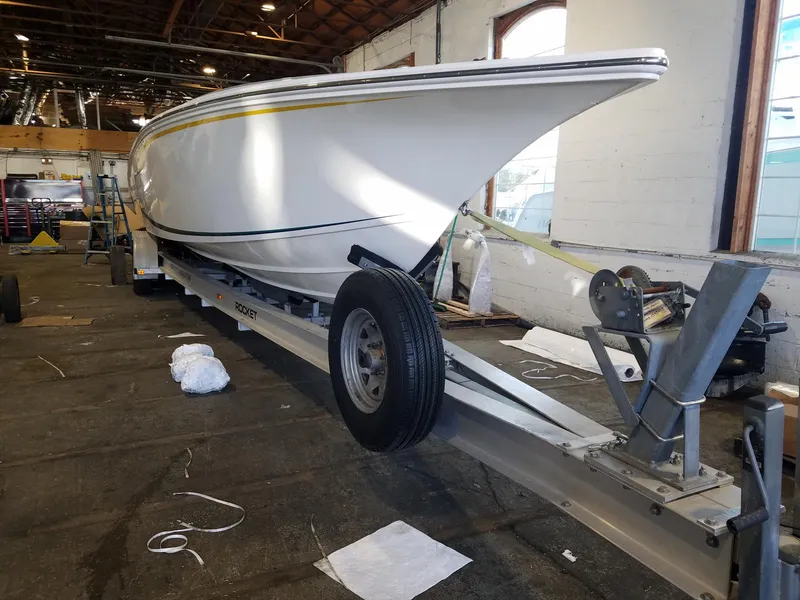 Slide: The Image of 2008 Fountain 42 Executioner boat on trailer in a warehouse setting. - 37