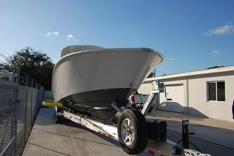 Slide: The Image of 2025 Cape Horn 36 XS boat on trailer in driveway. - 1