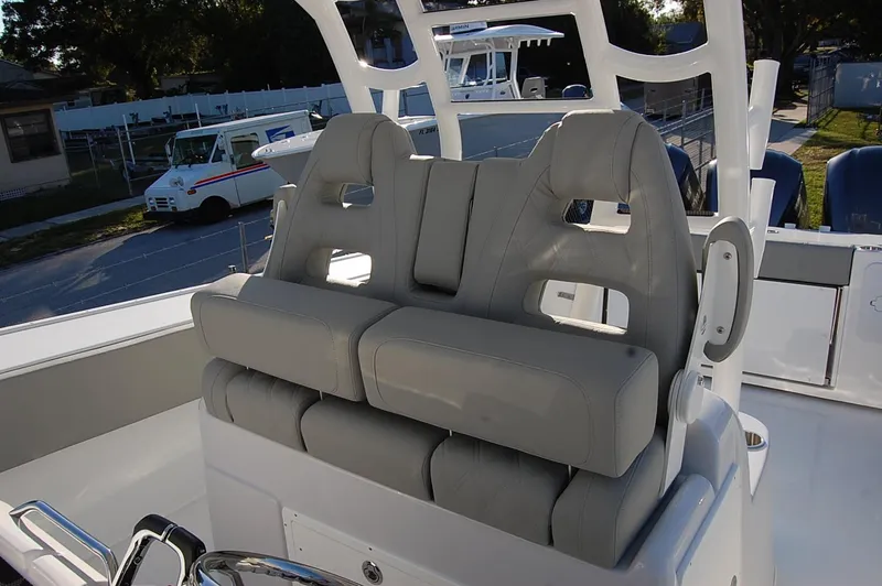 Slide: The Image of 2025 Cape Horn 36 XS boat with dual captain's chairs and modern helm station. - 12