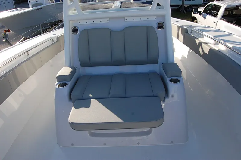 Slide: The Image of 2025 Cape Horn 36 XS boat with cushioned seating and cup holders. - 18