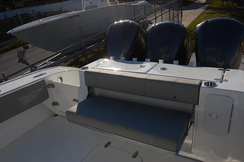 Slide: The Image of 2025 Cape Horn 36 XS boat with triple outboard engines and rear seating. - 20