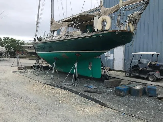 Slide: The Image of 1968 Hinckley Bermuda 40 sailboat on stands in a boatyard. - 15