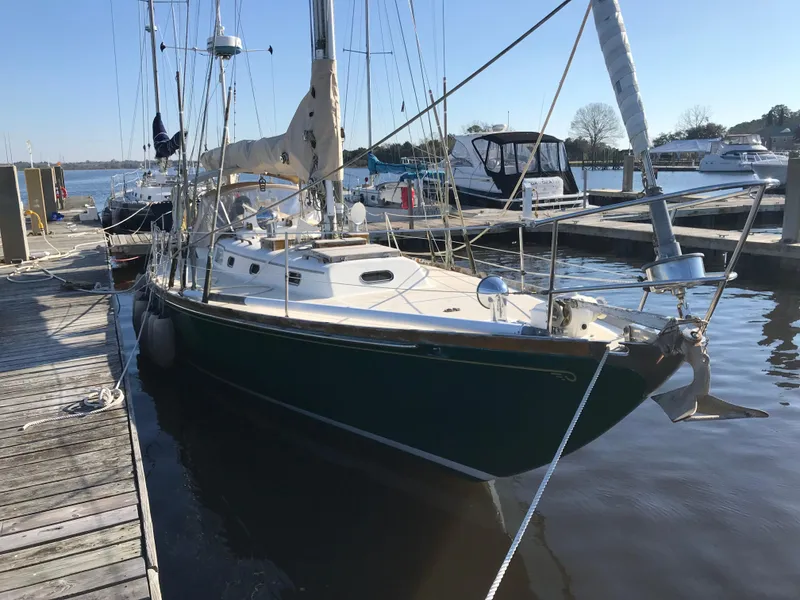 Slide: The Image of 1968 Hinckley Bermuda 40 sailboat docked at a marina. - 4