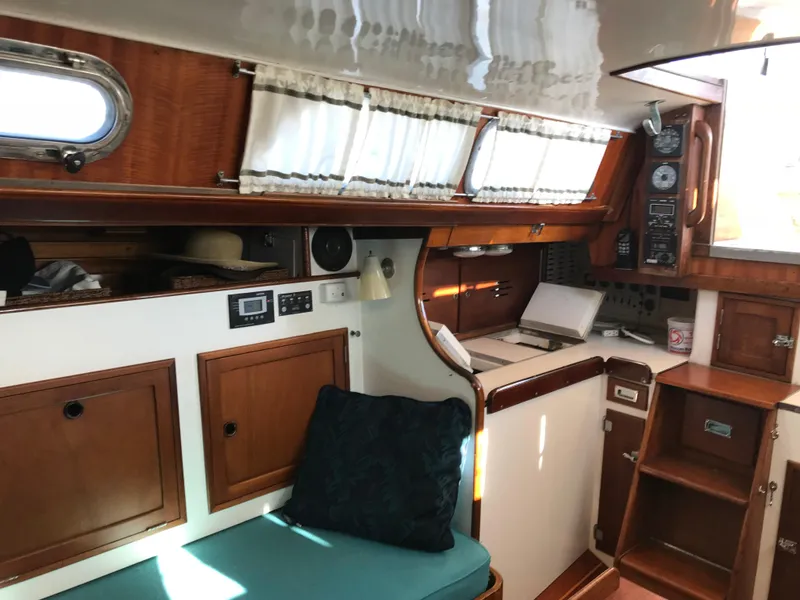 Slide: The Image of Interior of 1968 Hinckley Bermuda 40 sailboat with wooden cabinetry and seating. - 9