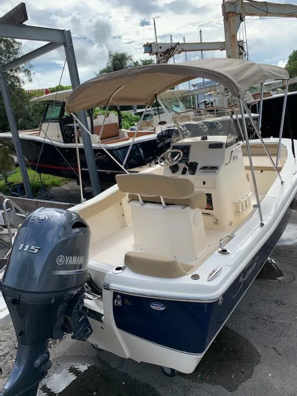 Slide: The Image of 2025 Scout 195 Sportfish boat with Yamaha 115 outboard motor. - 2