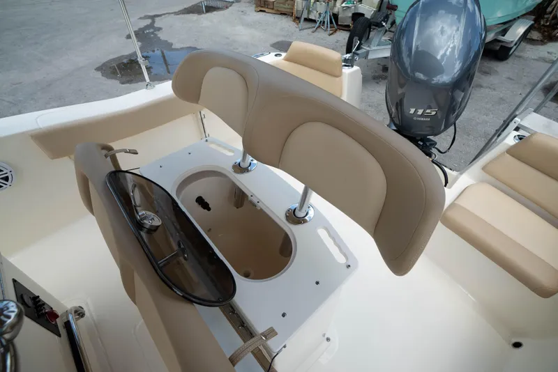 Slide: The Image of 2025 Scout 195 Sportfish boat interior with Yamaha 115 engine and seating area. - 9