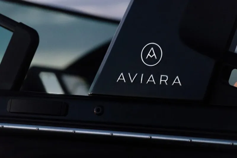 Slide: The Image of 2023 Aviara AV32 Outboard logo on boat exterior. - 9