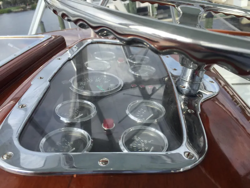 Slide: The Image of 1965 Rybovich 37 Sportfish dashboard with vintage gauges and polished metal details. - 11