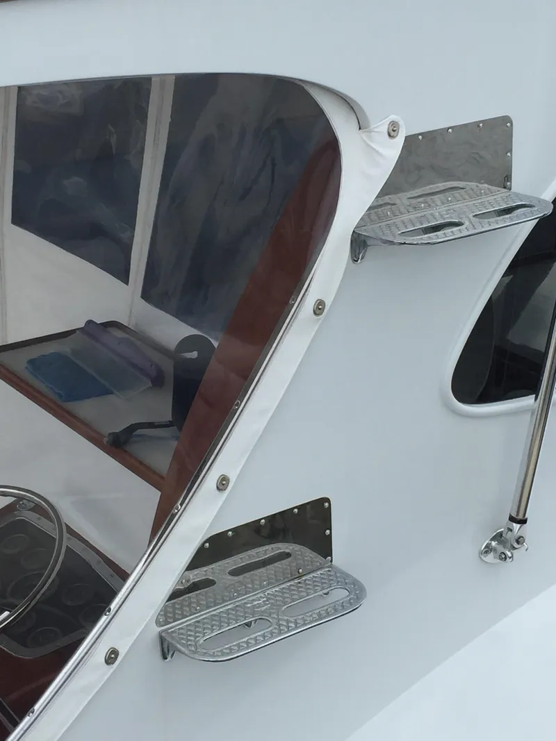 Slide: The Image of 1965 Rybovich 37 Sportfish boat with sleek design and stainless steel steps. - 15