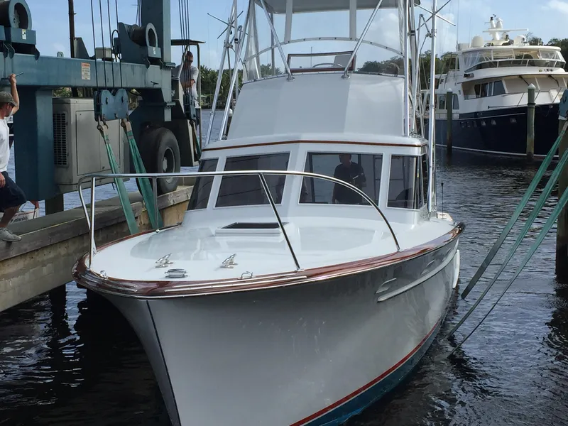 Slide: The Image of 1965 Rybovich 37 Sportfish boat docked at marina, ready for fishing adventure. - 20