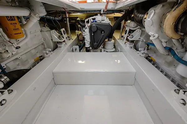 Slide: The Image of Engine room of a 1965 Rybovich 37 Sportfish boat, showcasing mechanical components. - 25