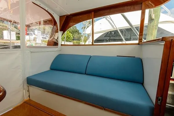Slide: The Image of Blue cushioned seating on 1965 Rybovich 37 Sportfish boat interior. - 30