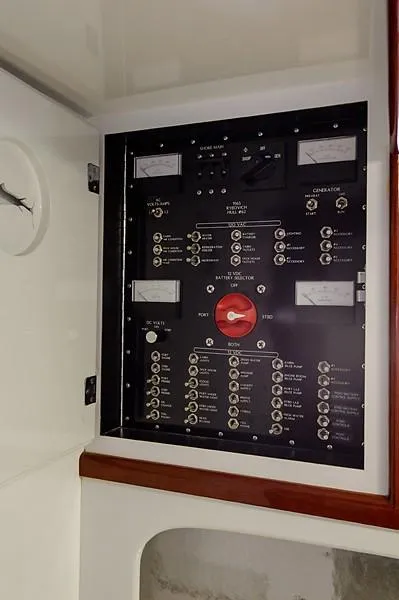 Slide: The Image of Electrical panel of a 1965 Rybovich 37 Sportfish boat, featuring various switches and gauges. - 31