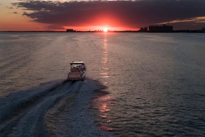 Slide: The Image of Aviara AV32 boat cruising at sunset, 2023 model. - 16