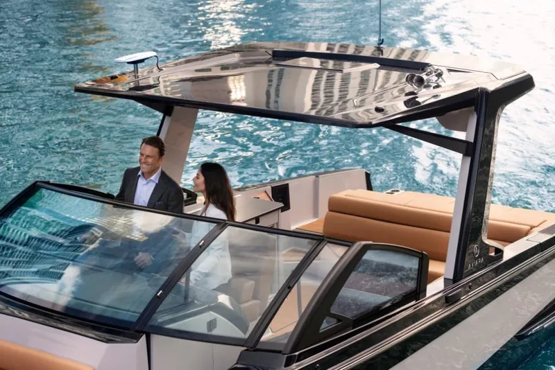 Slide: The Image of 2023 Aviara AV32 boat cruising with passengers on a sunny day. - 3