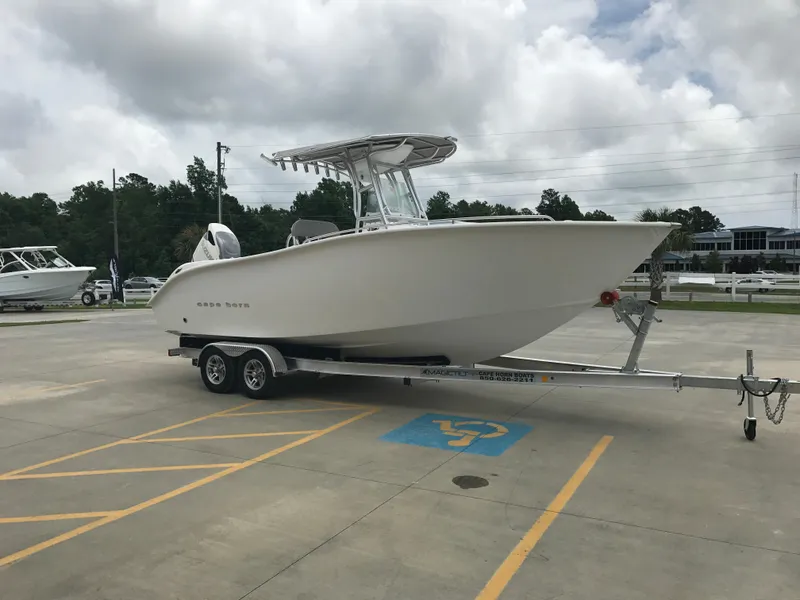 Slide: The Image of 2024 Cape Horn 22OS boat on a trailer in a parking lot. - 3