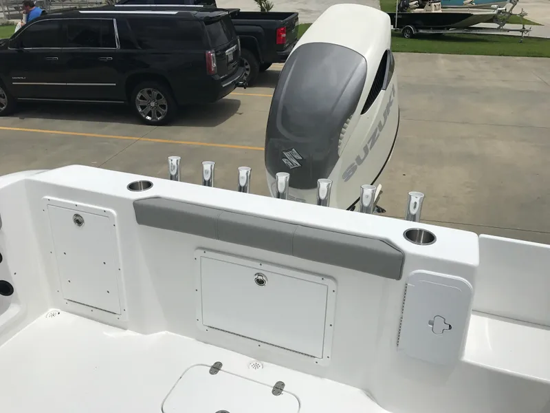 Slide: The Image of 2024 Cape Horn 22OS boat with Suzuki outboard motor and rod holders. - 5
