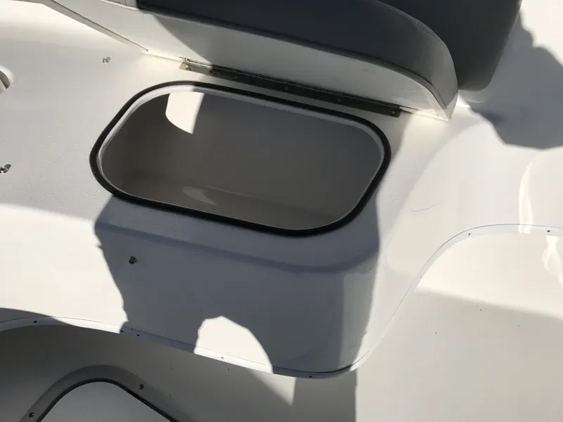 Slide: The Image of 2024 Cape Horn 27 XS boat storage compartment with open lid. - 12