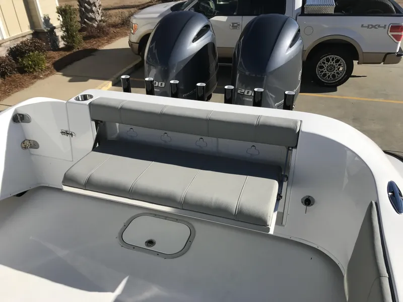 Slide: The Image of 2024 Cape Horn 27 XS boat with dual outboard engines and rear seating. - 13