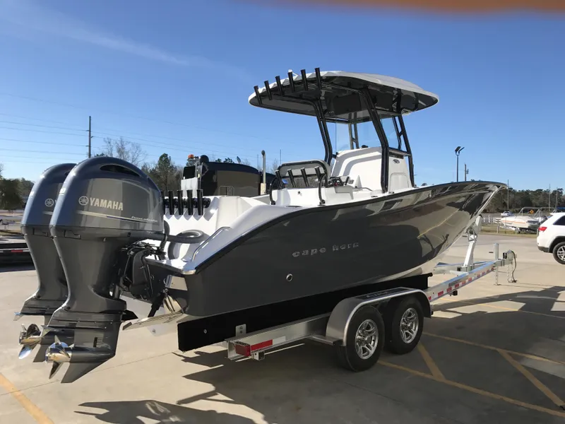 Slide: The Image of 2024 Cape Horn 27 XS boat on trailer with twin Yamaha engines. - 3