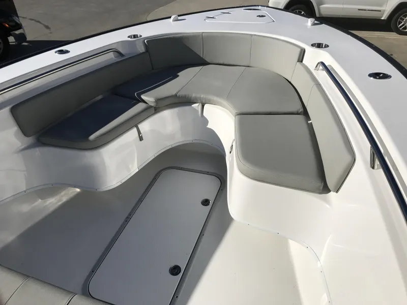 Slide: The Image of 2024 Cape Horn 27 XS boat with spacious seating area and storage compartments. - 9