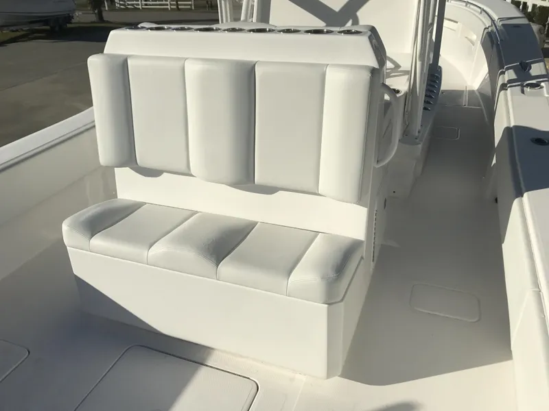 Slide: The Image of 2024 Invincible 36 boat with white cushioned seating. - 15