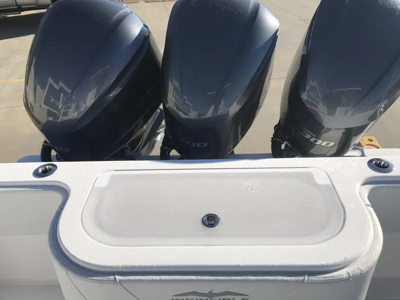 Slide: The Image of 2024 Invincible 36 boat with triple outboard engines. - 17