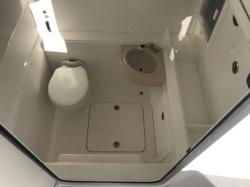 Slide: The Image of 2024 Invincible 36 boat bathroom with toilet and sink. - 22