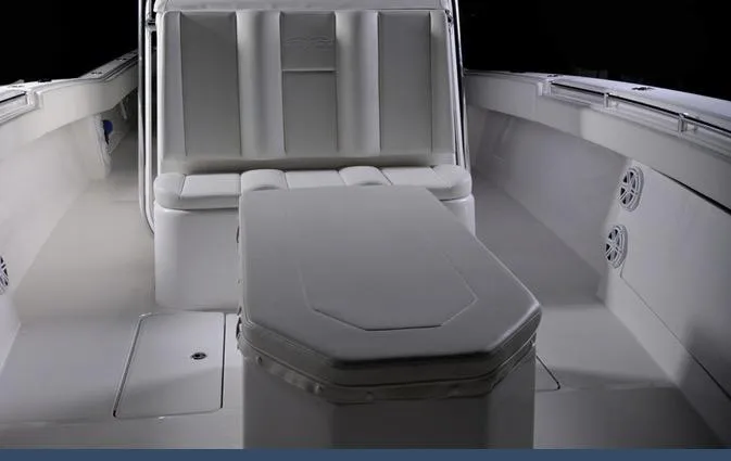 Slide: The Image of 2024 Invincible 42 boat interior with cushioned seating and storage. - 10